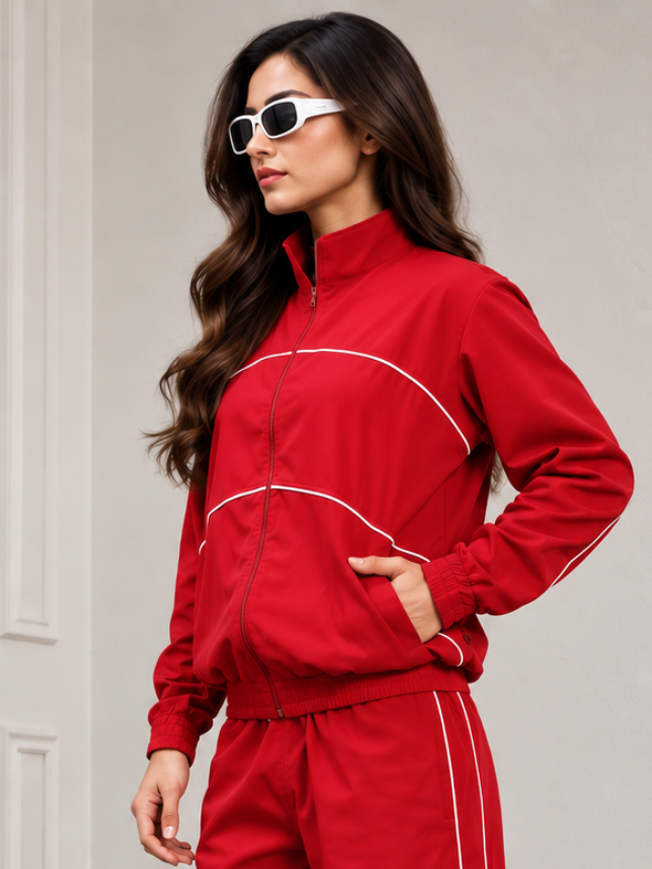 WOMEN RAIDER JACKET FULL ZIPPER RED on a model wearing sunglasses, showcasing a stylish athletic look.