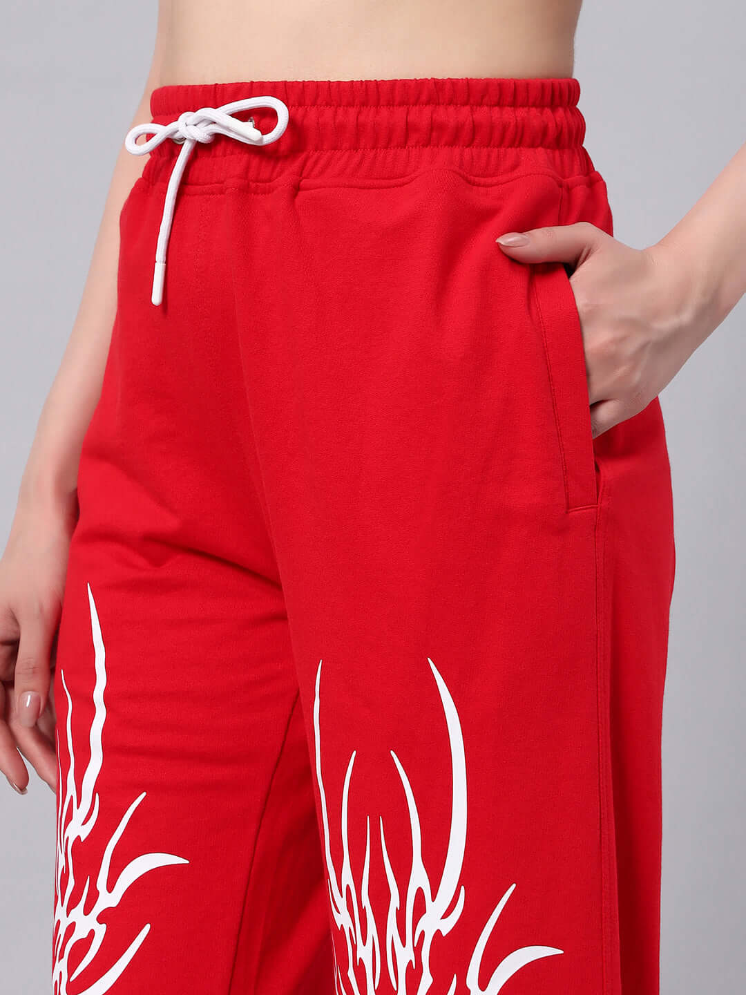 WOMEN'S REDX BRANCHING JOGGER RED with custom fit option, made by DUDS Tailors, showing white drawstring and side pocket.
