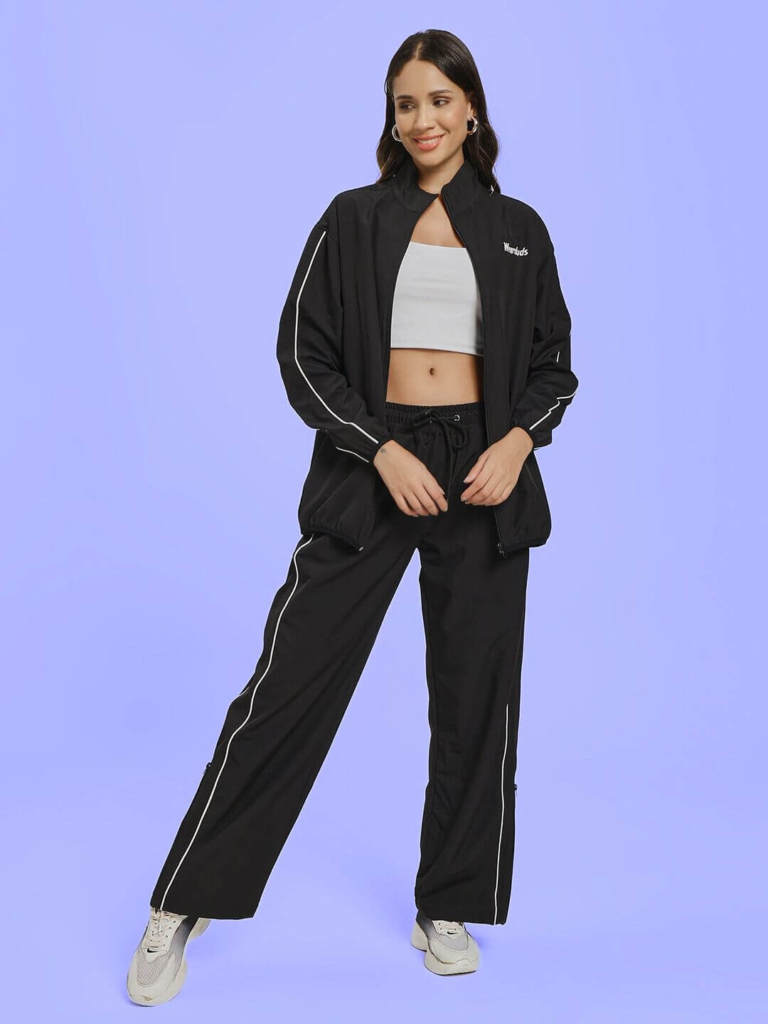 Model wearing WOMEN RELIGHT RELAXED FIT CO-ORD SET BLACK, showcasing chic loungewear style.