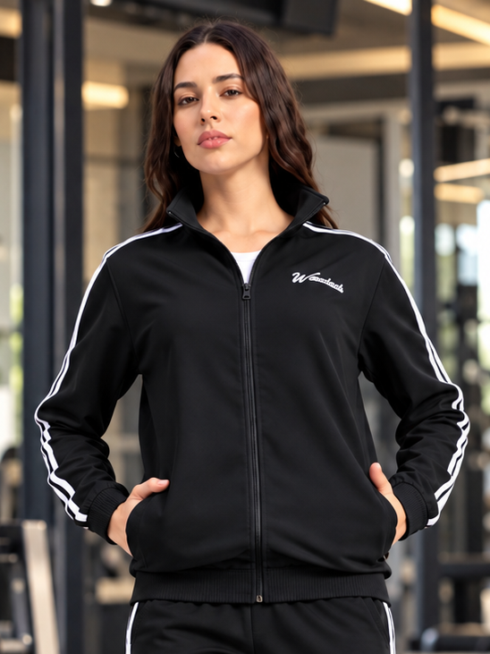 WOMEN SPORTY ZIP UP RELAXED FIT JACKET BLACK worn by model with white stripe detailing, gym background