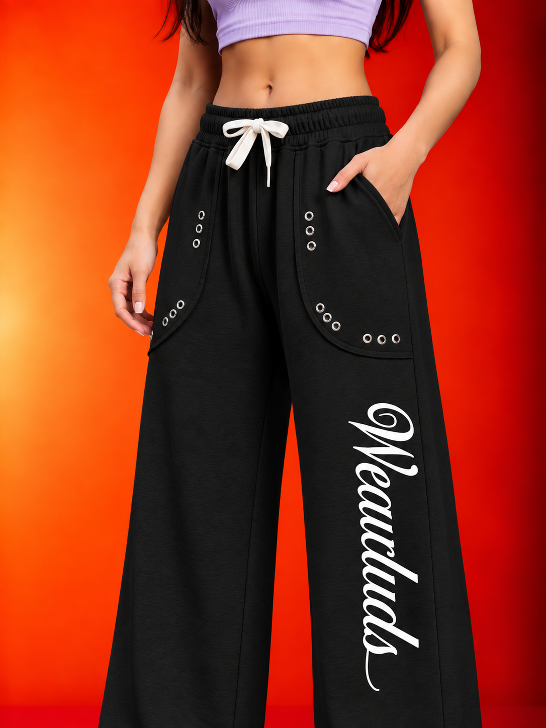 WOMEN EYELET FIT GRAPHIC JOGGERS BLACK with drawstring waist and pocket eyelet details