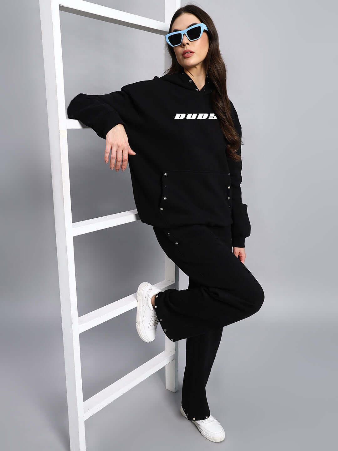 Model wearing WOMEN RIGID FLEECE HOODIE BLACK from DUDS, perfect for custom-fit styling.
