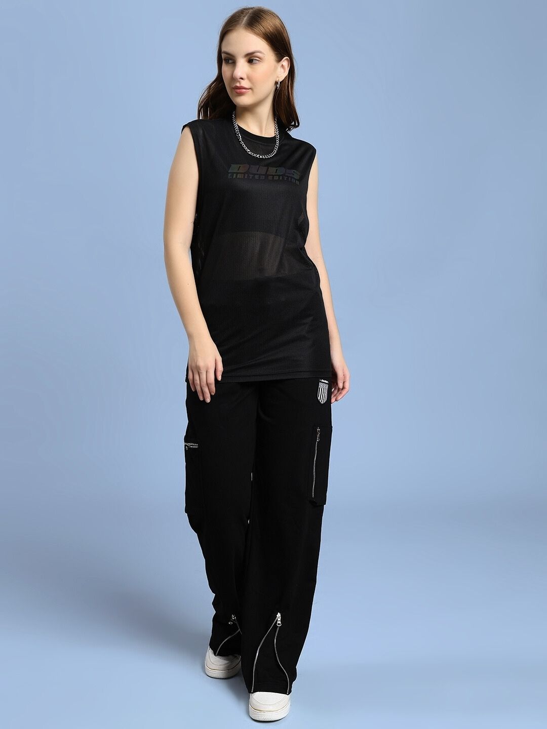 Woman wearing WOMEN'S AIR-FLOW REGULAR FIT T-SHIRT BLACK for comfort and style