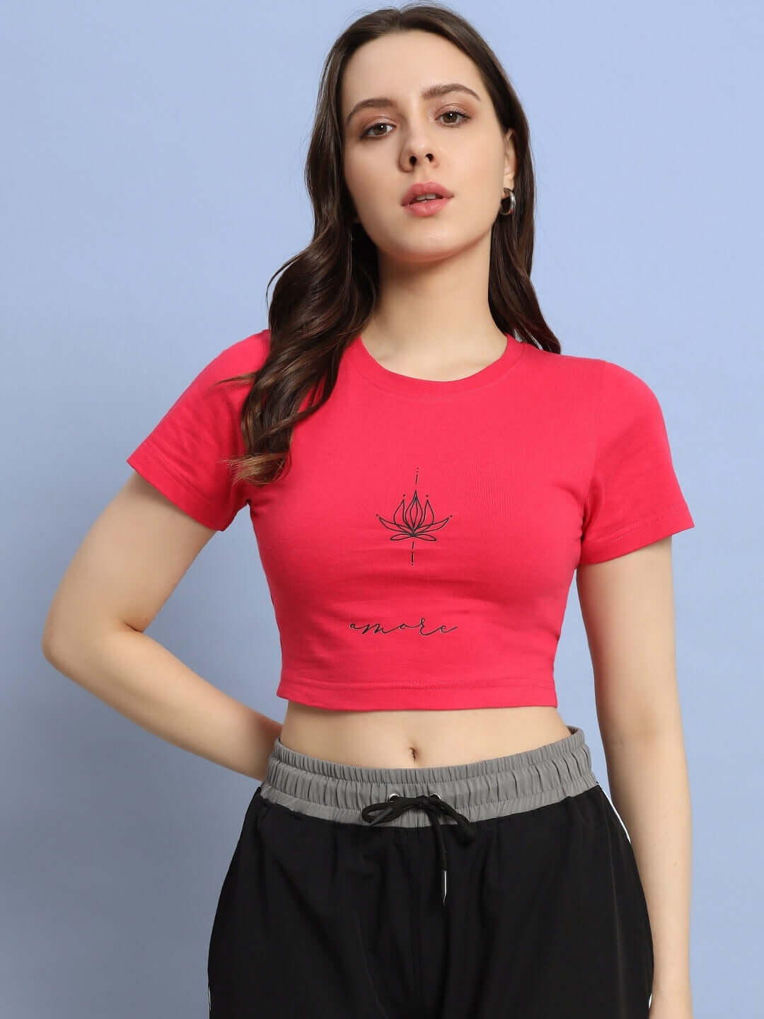 Model wearing Women's Amore Crop-Top in Pink, made from premium 100% cotton rib fabric, 230 GSM, bio-washed for softness.