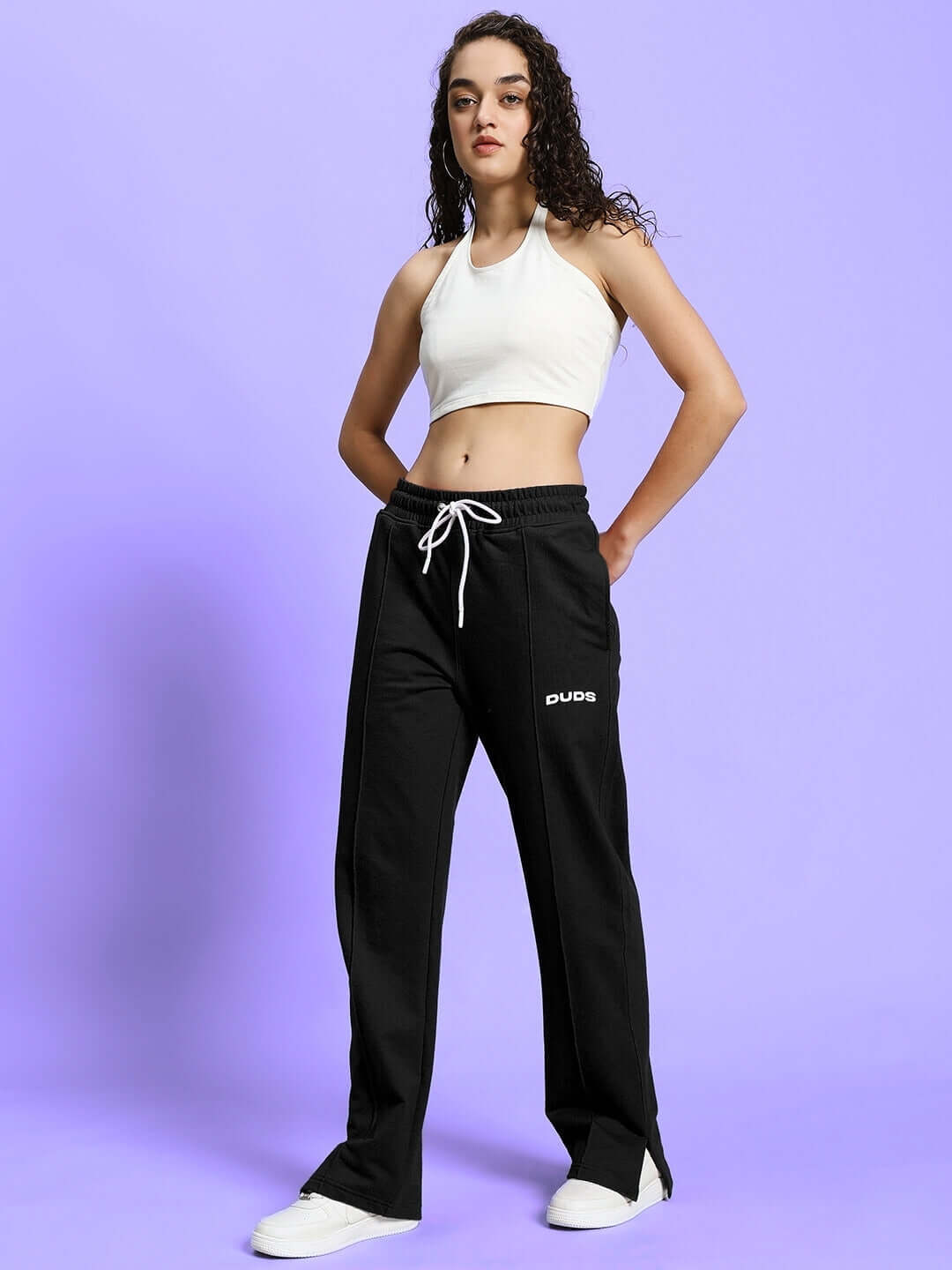 Model wearing Women's Anissa Co-ord Set in black and off-white, featuring relaxed fit joggers with elasticated waistband and drawstring.