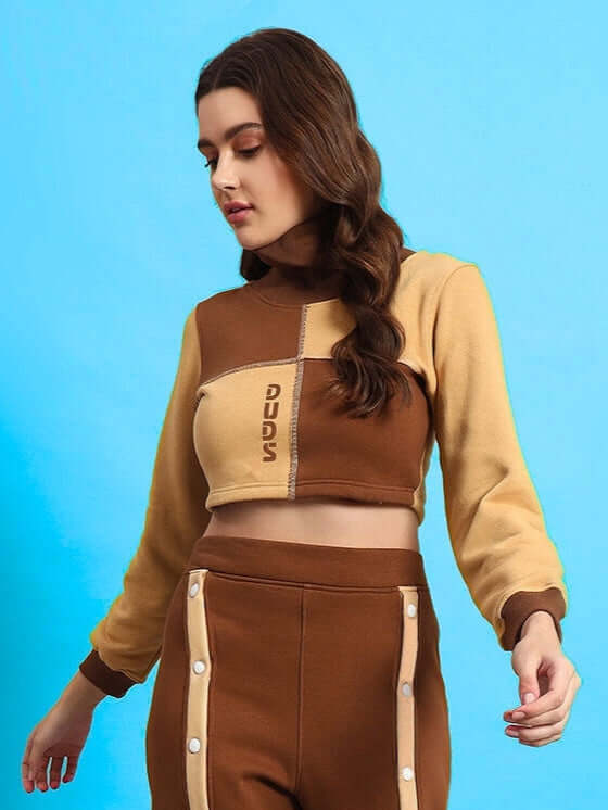 Woman wearing beige-brown women's Aurora co-ord set made of premium cotton fabric with French terry and elastane, front view.