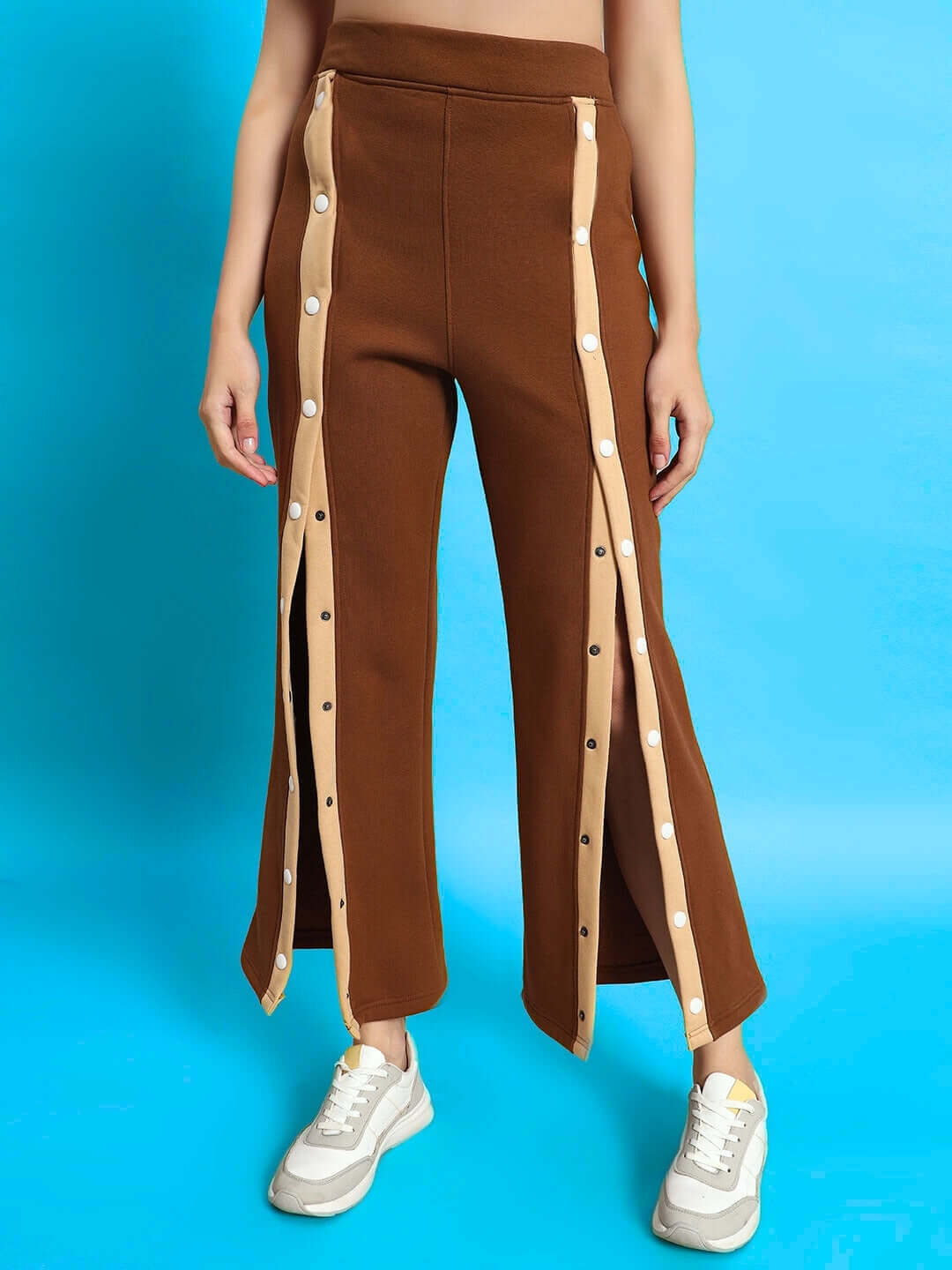 Women's Aurora Fleece Front Open Pant in beige-brown with side button details, worn by model. Stylish casual wear.