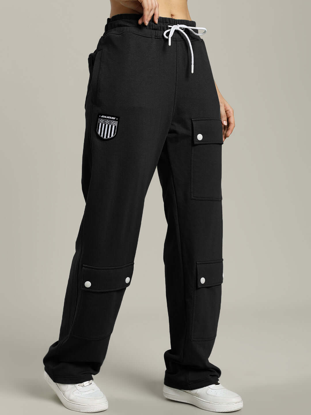 Black women's baggy joggers with flap pockets, drawstring waist, and casual style for comfortable wear.
