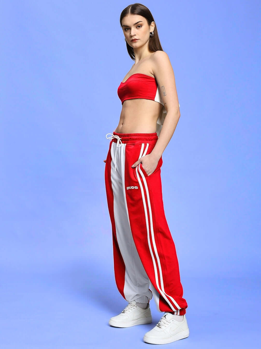 Model wearing Women's Azora Co-ord Set in Red-White, featuring relaxed fit joggers with elastic waistband, made from premium cotton blend.