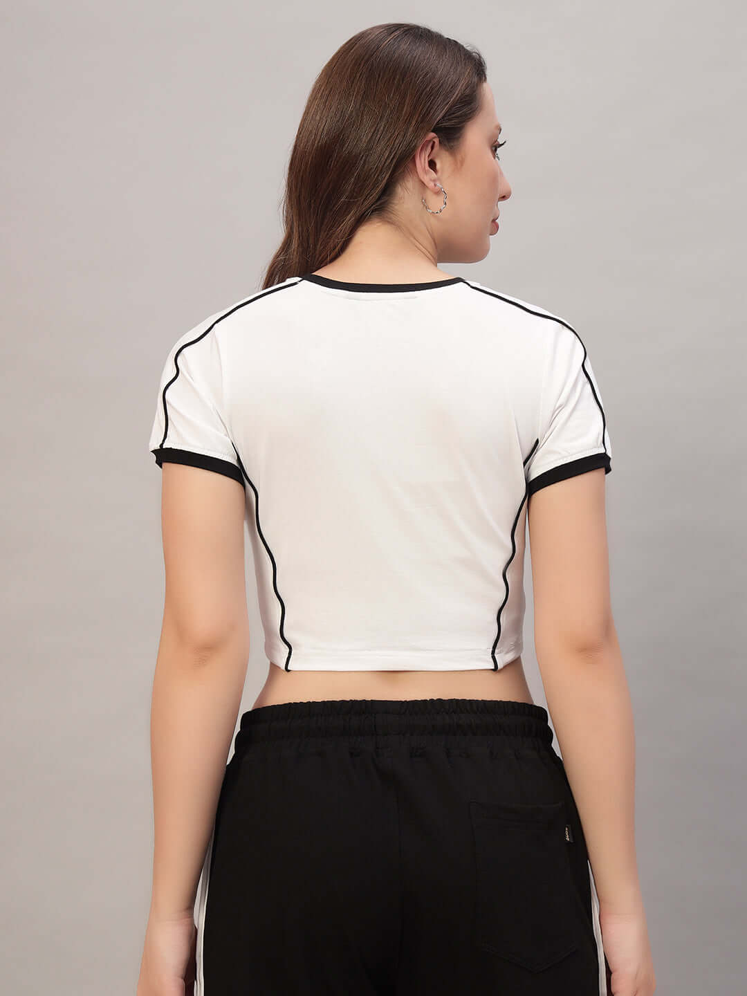 Back view of stylish women's white Bandit crop-top made from premium heavy gauge cotton, highlighting black trim details. Perfect for casual wear.
