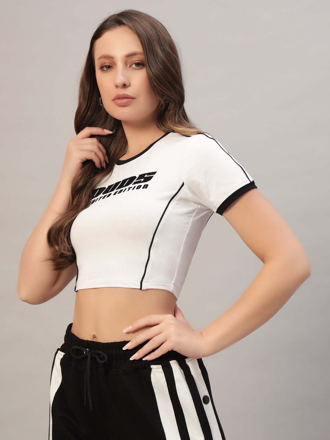Model wearing Women's Bandit Crop-Top in white, made from premium 100% cotton fabric with a stylish, comfortable fit, perfect for casual outings.