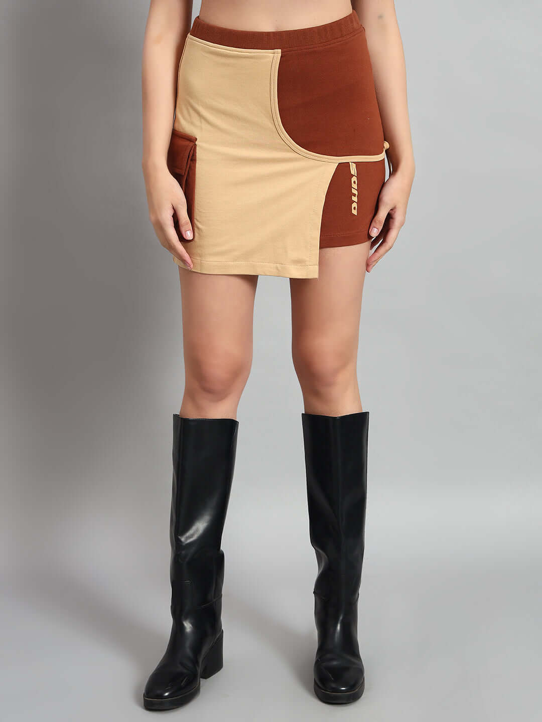 Woman wearing WOMEN APPLIC CO-ORD SET BEIGE BROWN with black boots, showcasing chic comfort and versatility.