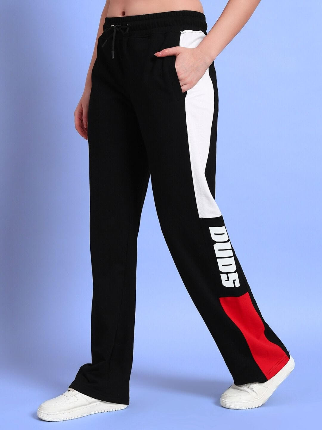 Women's relaxed-fit black and red joggers by DUDS, featuring side pockets and logo detailing. Stylish casual wear for everyday comfort.