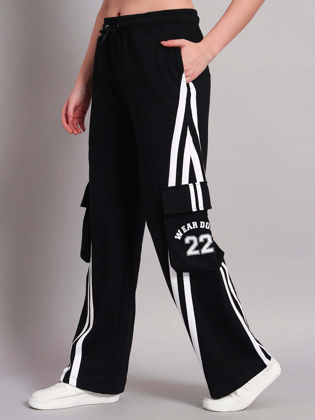Women's black joggers with multi pockets and relaxed-fit, featuring white side stripes and custom options, by DUDS.