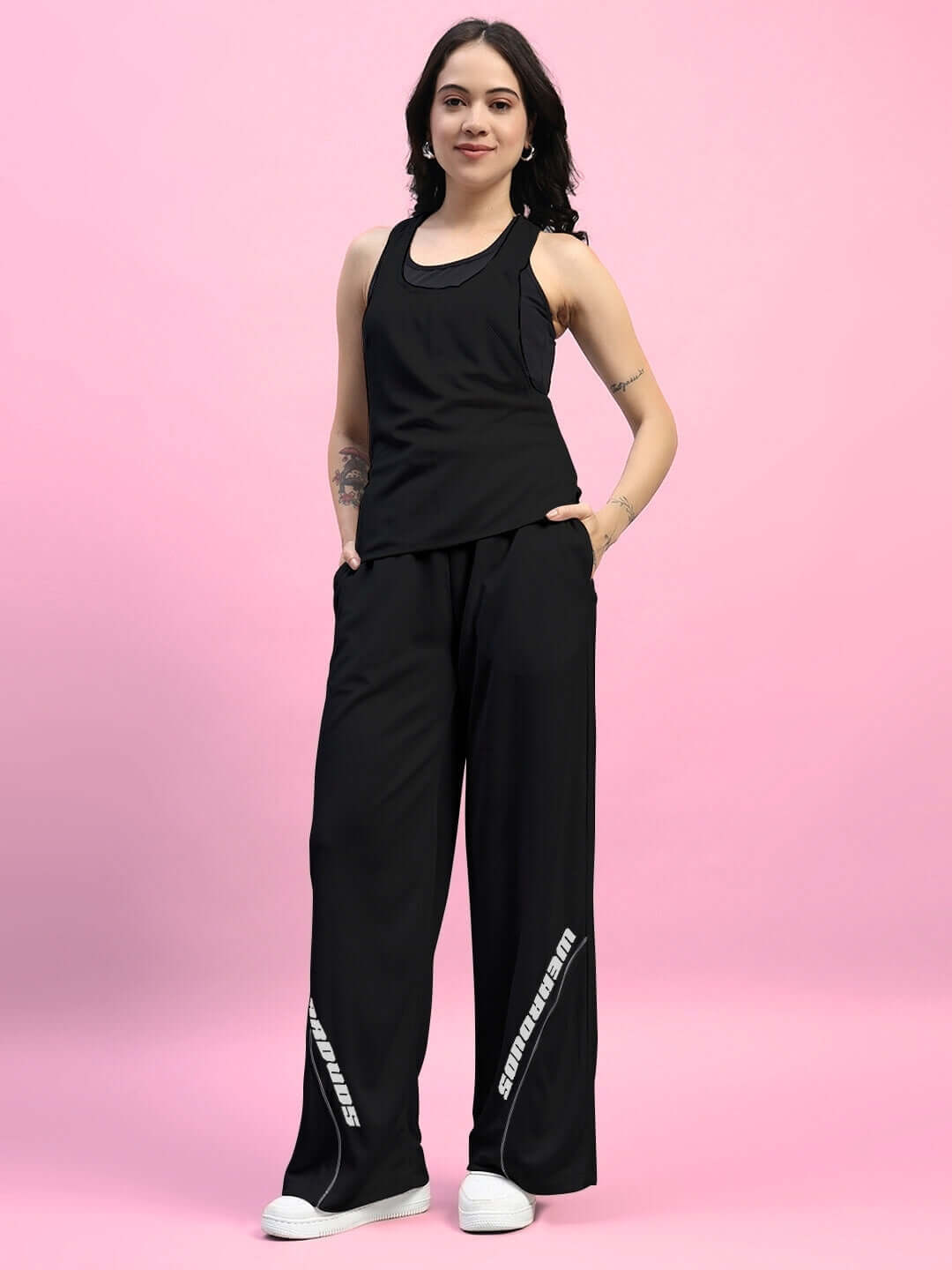 Women's black cubby co-ord set with relaxed fit joggers and elasticated waistband, designed for comfort and style.