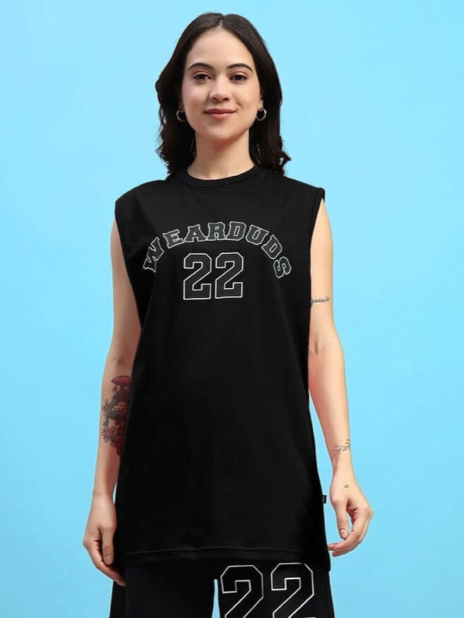 Woman wearing a black AMIGA gym t-shirt with 'WEARDUDS 22' print, offering a custom fit option for personalized sizing.