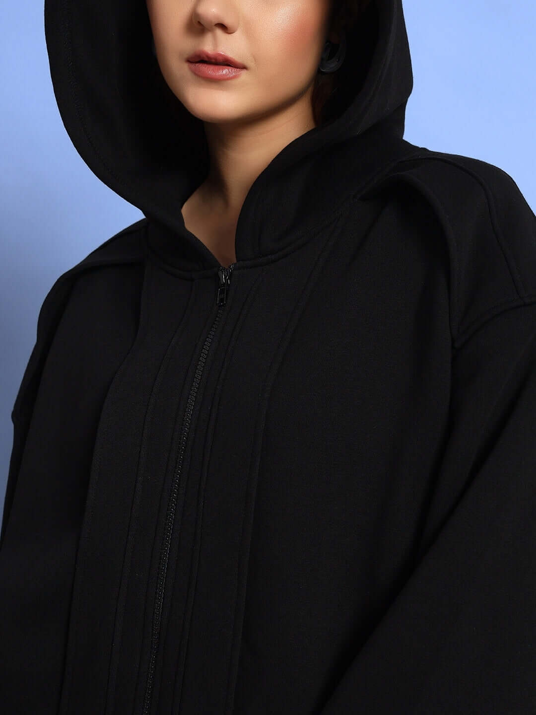 Close-up of WOMEN WD ADMIRE FLEECE HOODIE BLACK showcasing its sleek design and comfort.