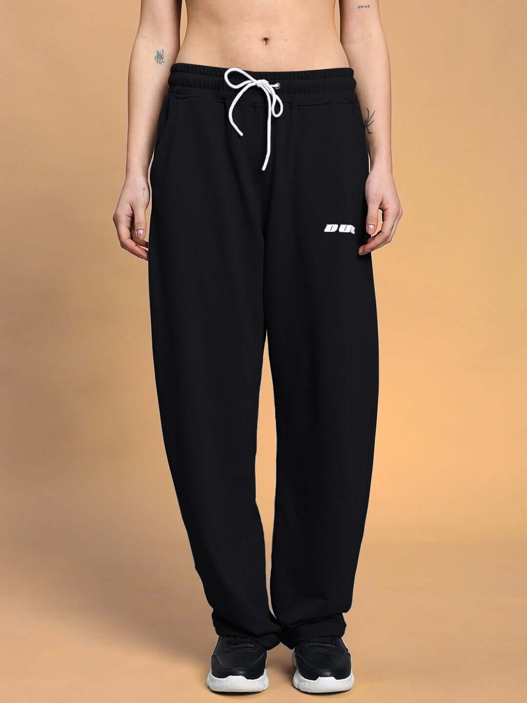 Black Lia Co-Ord Set with elastic waist and drawstring, featuring unisex relaxed fit joggers made of premium cotton blend.