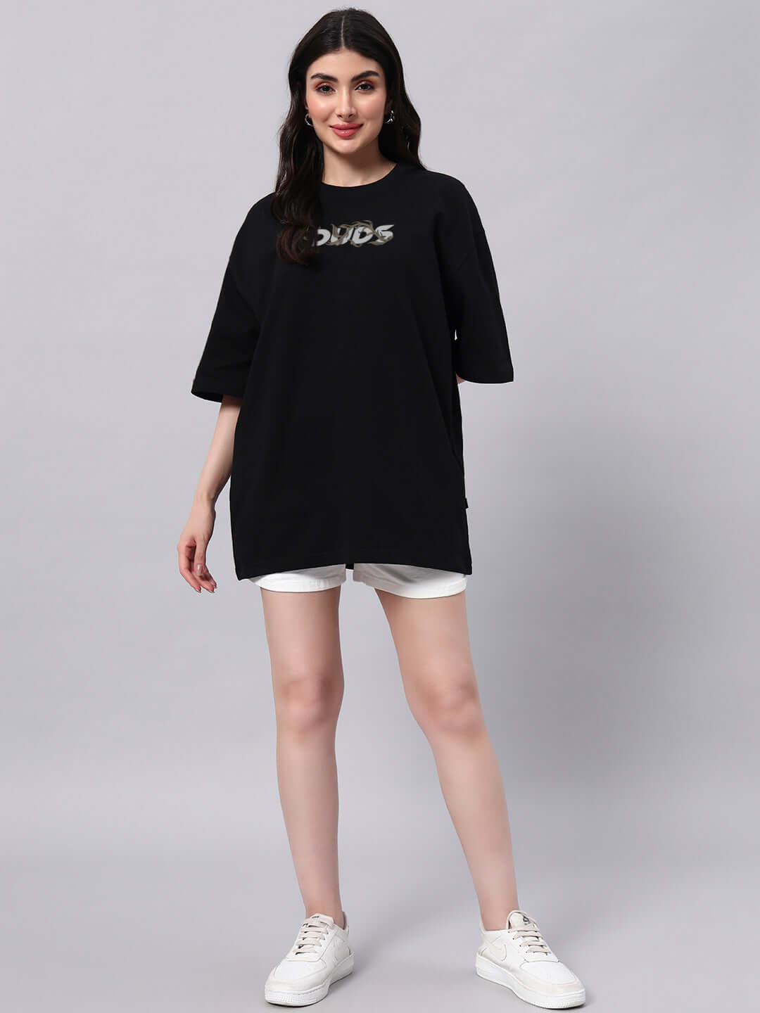 Model wearing WOMEN'S JELVIN OVER-SIZED T-SHIRT in black, premium cotton, French terry blend, comfortable fit, casual style.