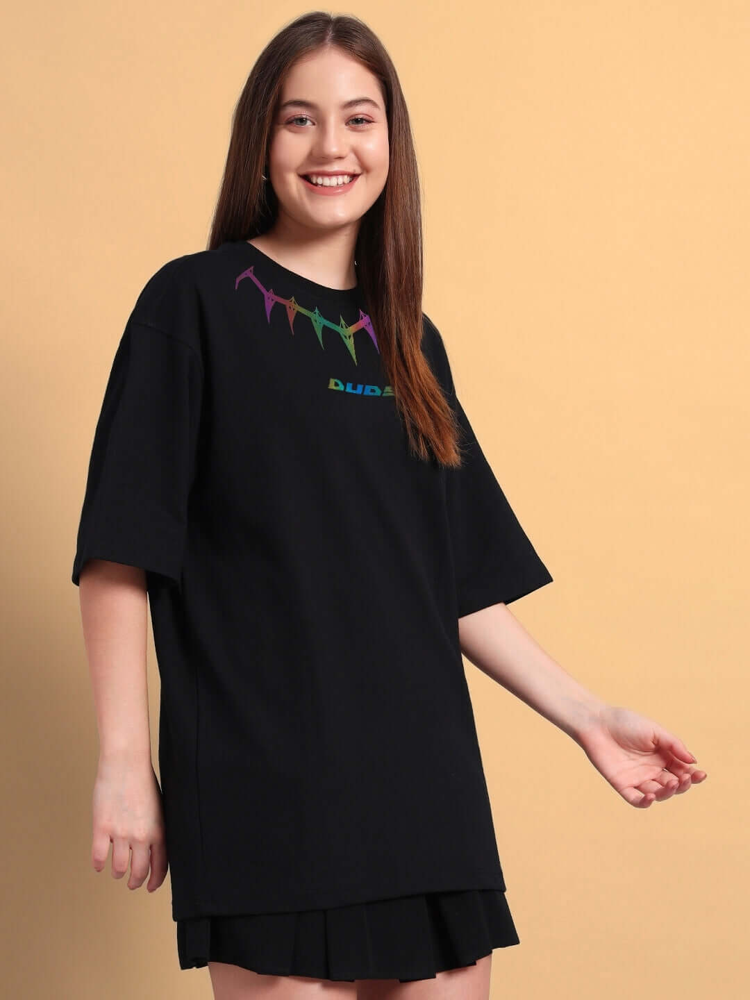 Woman wearing a Women's Black Panther Reflector Oversized T-Shirt made of premium cotton with colorful design on the chest, by Color By Colours.