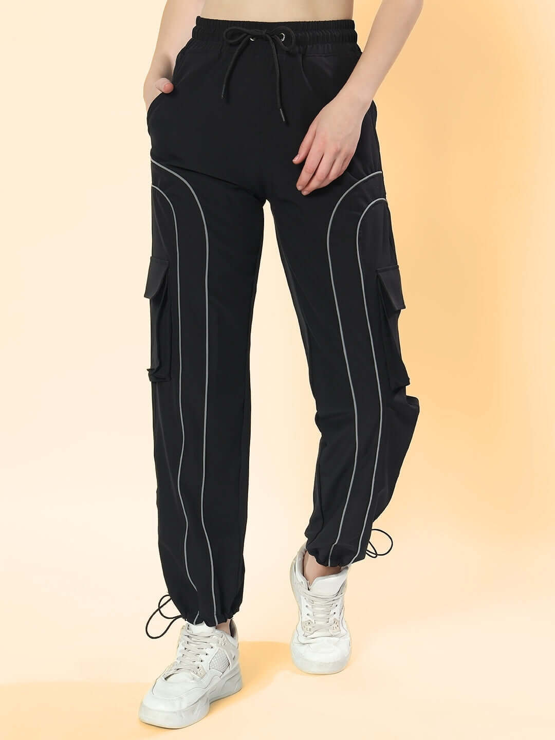 Women's black Ray Reflector parachute cargo pants with drawstring waist and pockets, perfect for custom fit and style.