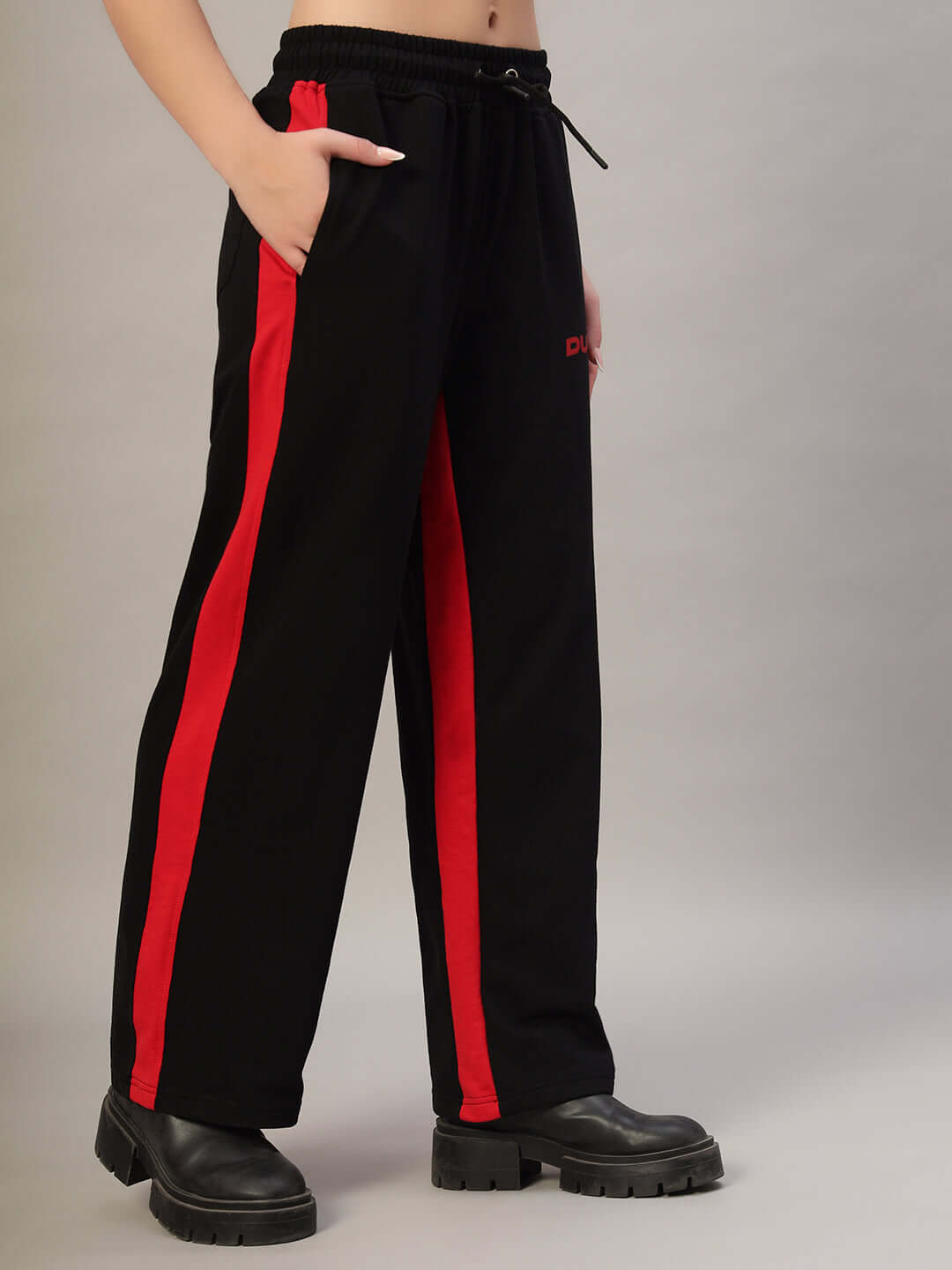 Women's black-red side seam baggy joggers by DUDS with customizable fit, shown with pockets and elastic waistband.
