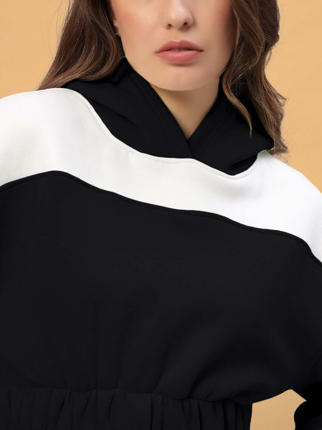 Close-up view of WOMEN RIZZLER OVERSIZED CROP HOODIES BLACK showing the stylish design and comfortable fit.