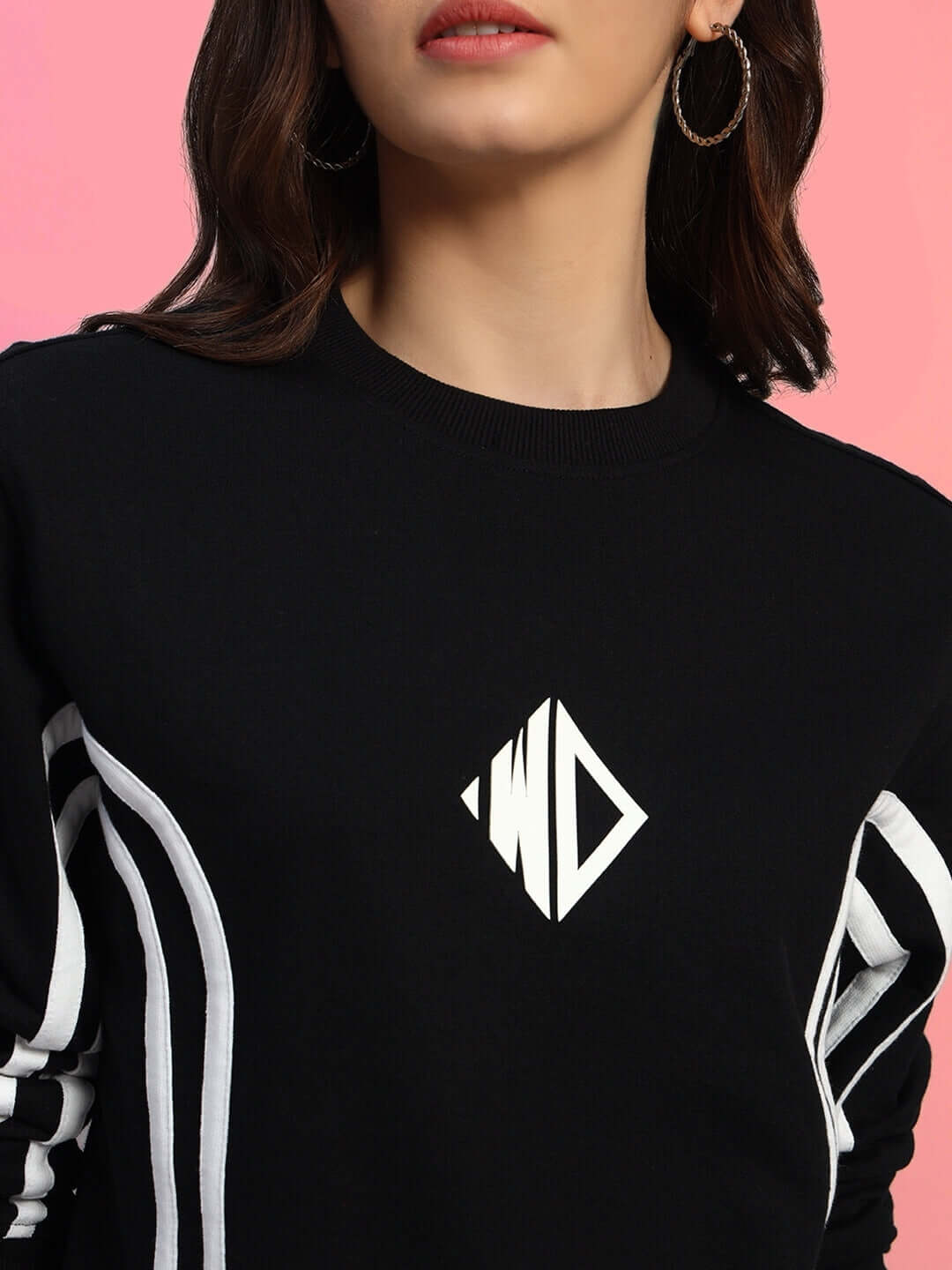 Model wearing WOMEN'S OUTLOOK SWEATSHIRT BLACK WITH WHITE STRIPE, showcasing premium fabric and sporty white stripe design.