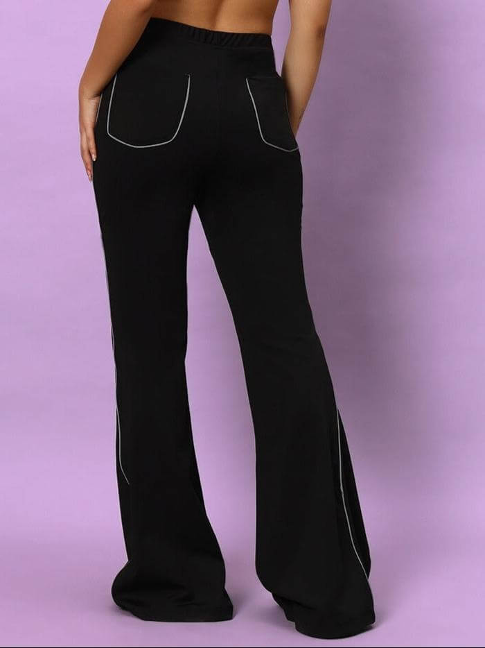 Back view of Women's Victoria Boot Cut Reflector Pants in black, showcasing reflective detail and tailored fit from DUDS.