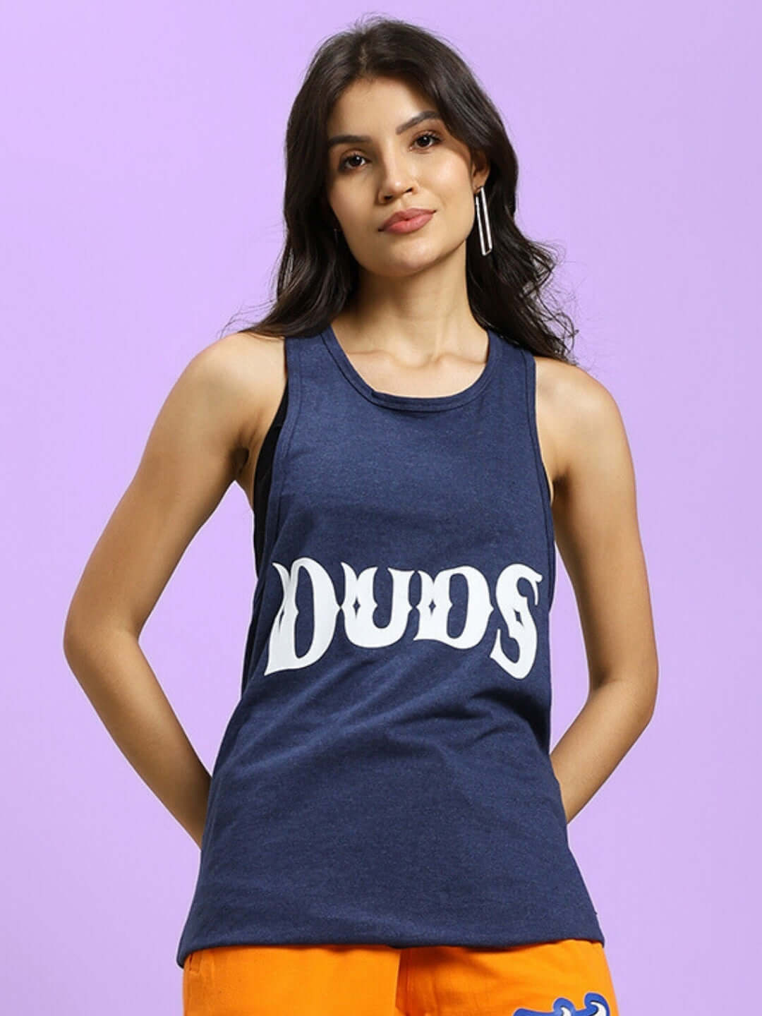 Woman wearing blue ZEMPA Fitness Gym T-Shirt by DUDS against a purple background.