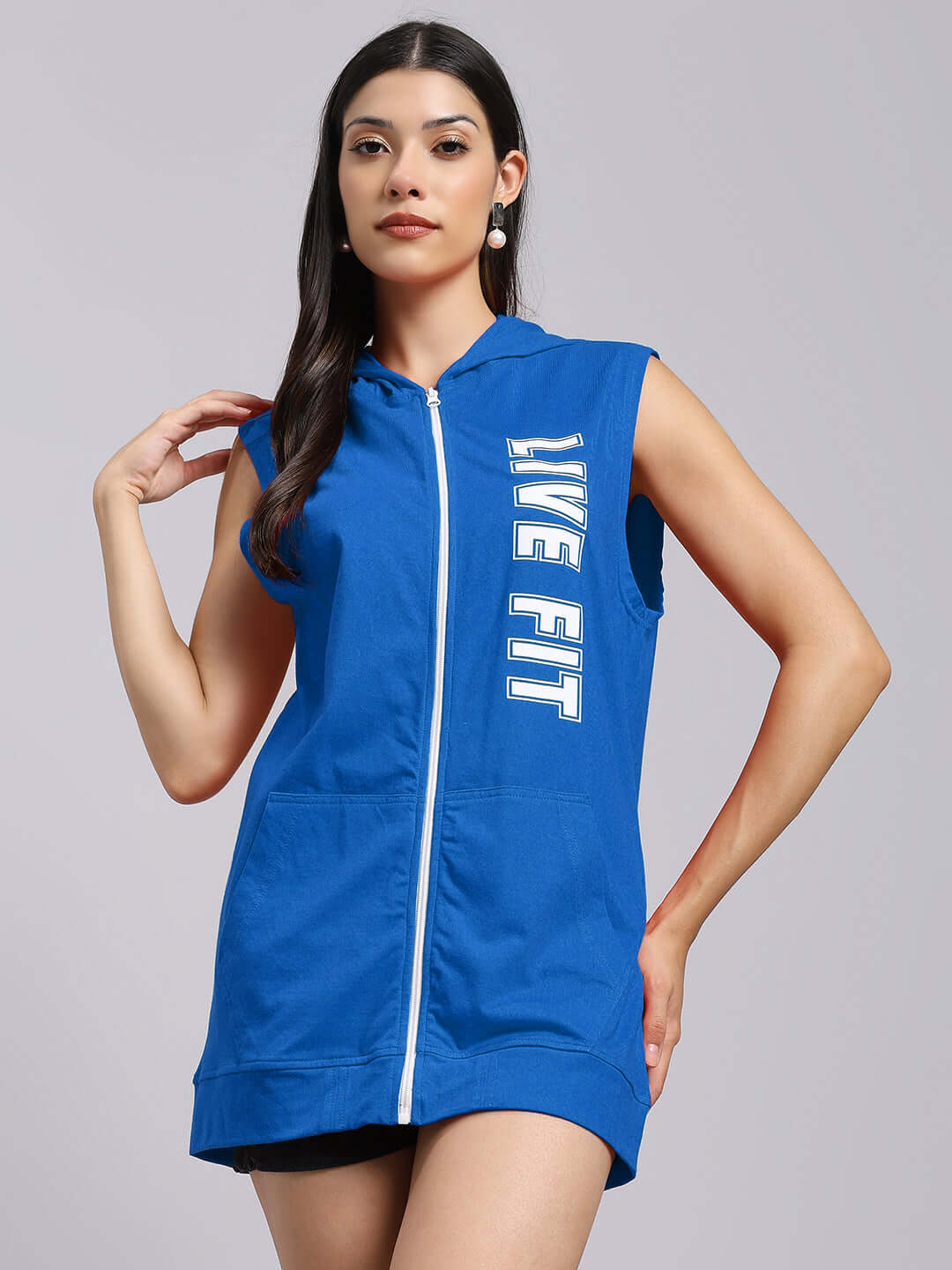 Woman wearing blue Live Fit gym hooded t-shirt, showcasing sporty design and breathable fabric ideal for workouts.