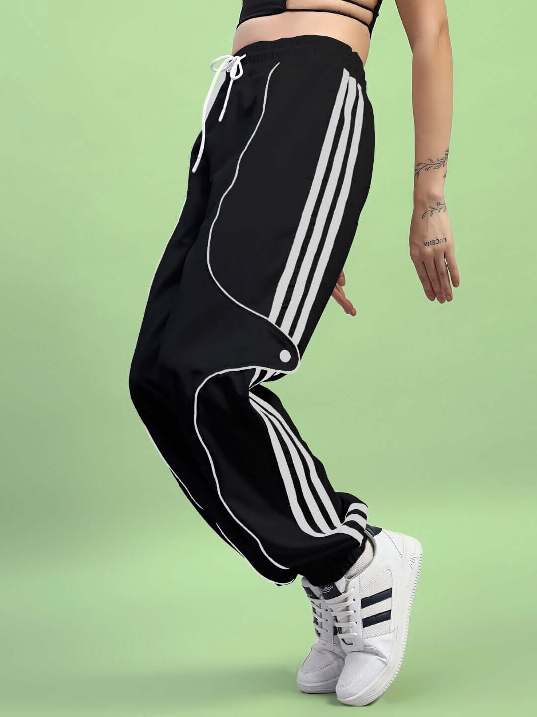 Black women's joggers with white stripes, showcasing a relaxed fit, perfect for casual wear and customizable sizing options.