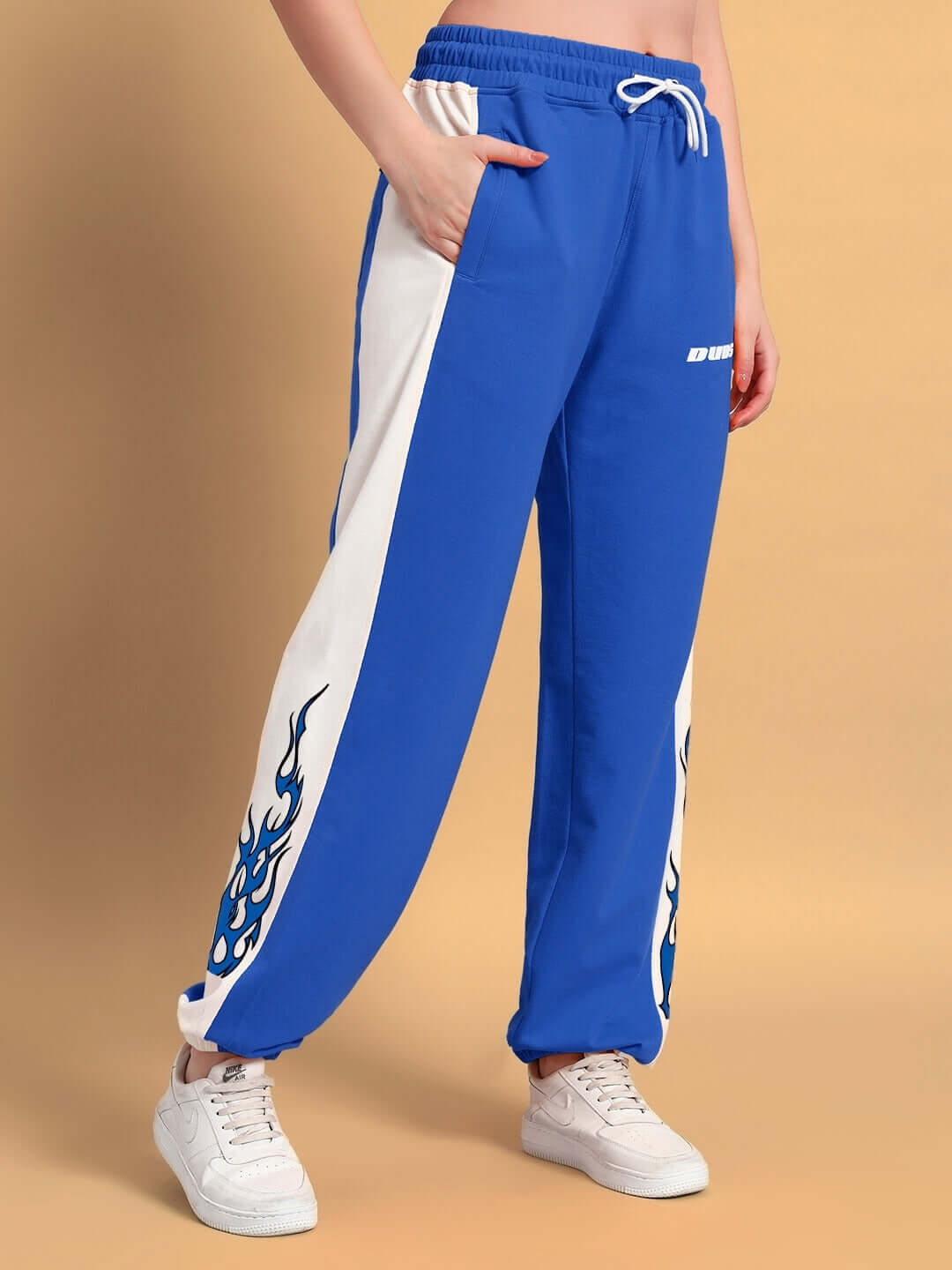 Women's Bracer Relaxed Fit Joggers in Blue-White with flame design, made to order by DUDS. Custom fit option available.