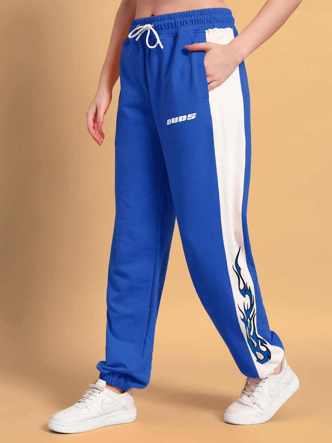 Women's bracer relaxed fit joggers in blue-white, featuring side pockets and comfortable waistband, ideal for casual wear.