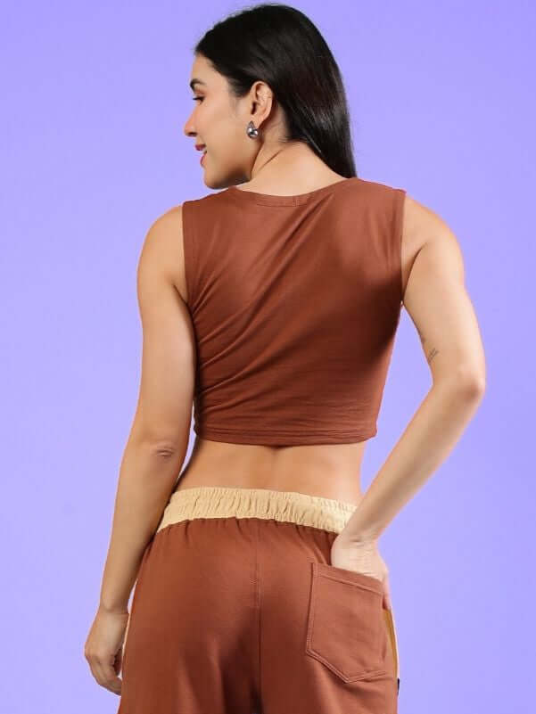 Back view of a woman wearing a brown women's bracing crop top, made with premium cotton and elastane. Perfect for casual wear.