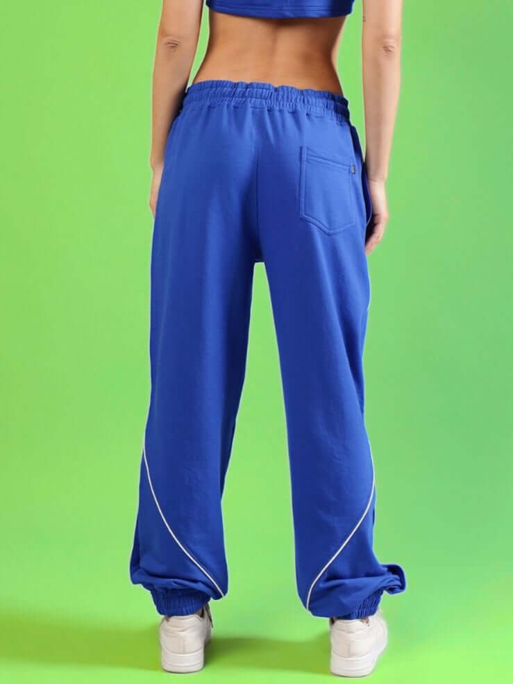 Rear view of WOMEN'S BROSSFINE CONTRAST JOGGERS in royal blue with stylish piping detail, perfect for a custom fit, by DUDS.