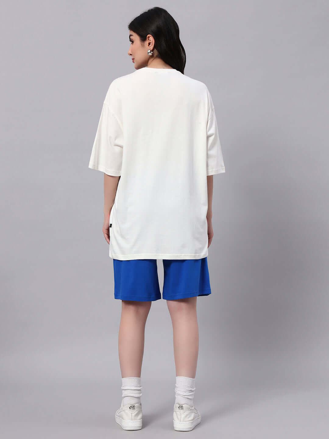 Back view of model wearing women's Bunny Bugs co-ord set in off-white and blue, showcasing premium cotton and elastane fabric.