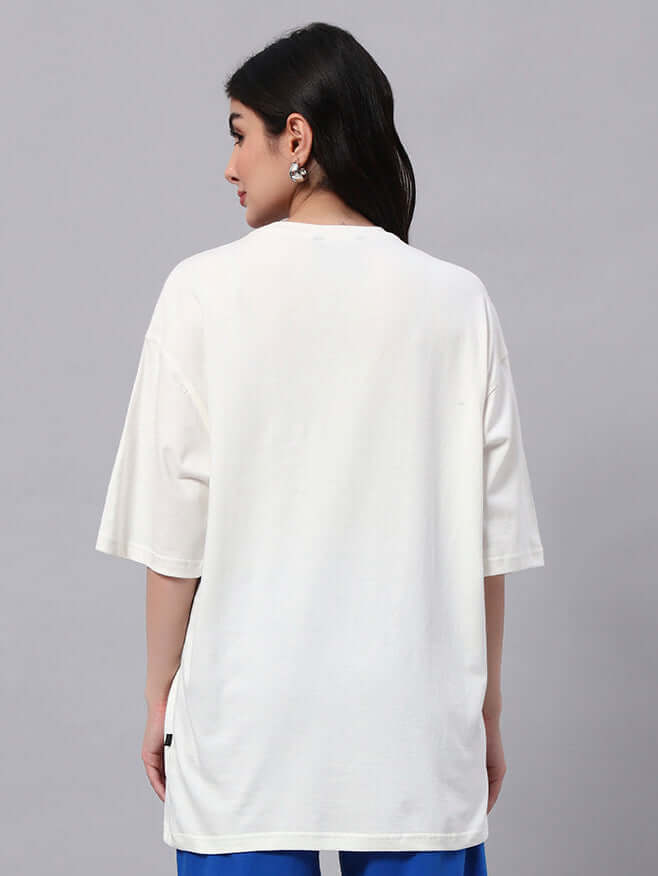 Woman wearing WOMENS BUNNY BUGS OVERSIZED T-SHIRT OFF-WHITE from the back view, showcasing casual style and comfort.