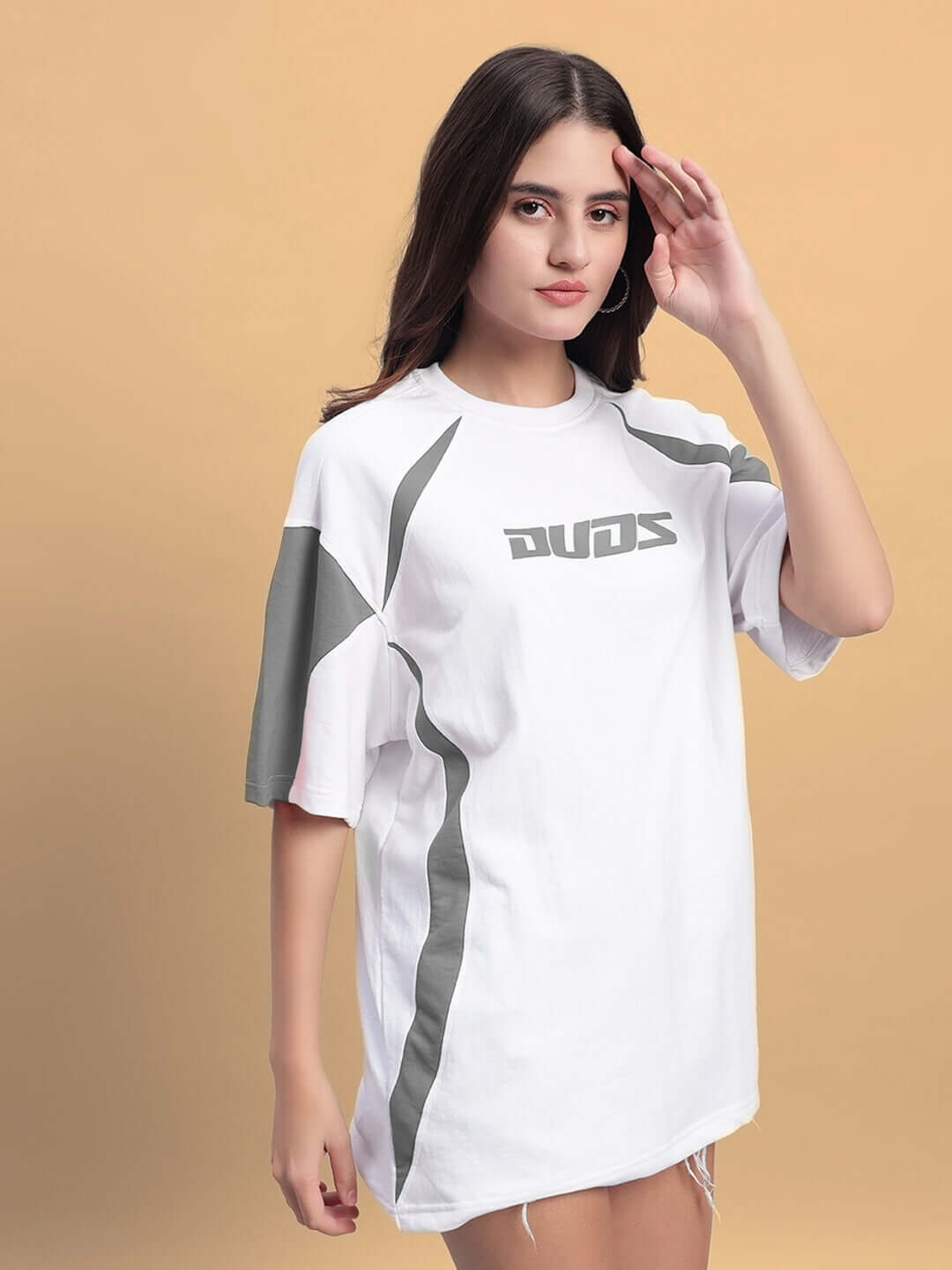 Woman wearing women's candor oversized t-shirt in white grey, featuring premium cotton French terry fabric and stylish design.