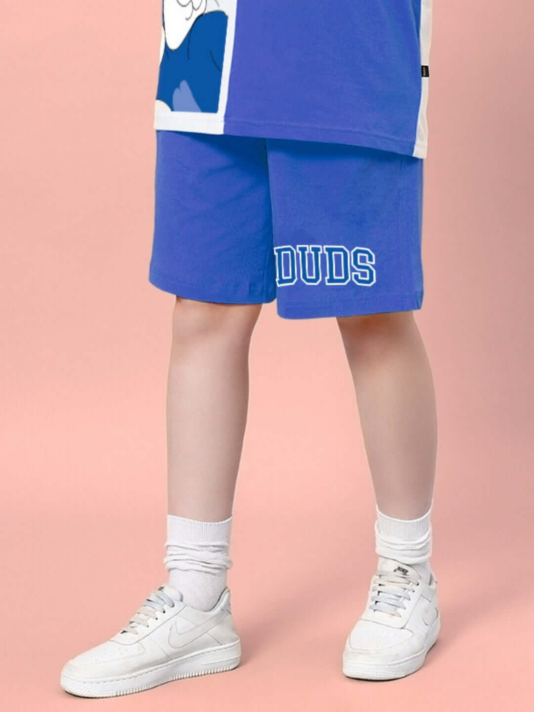 Blue Women's Caper Tom Summer Shorts by DUDS, featuring custom fit option, modeled with white sneakers.