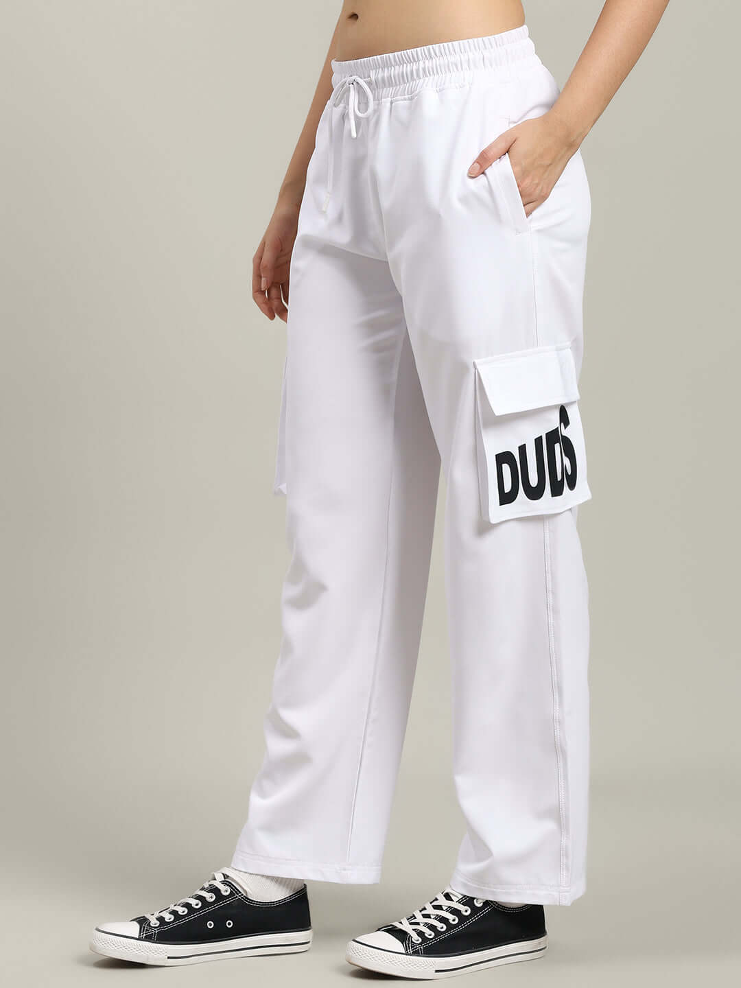WOMEN'S CARMINE RELAXED FIT JOGGER WHITE with side pockets and DUDS logo, styled for comfort and customizable fit.