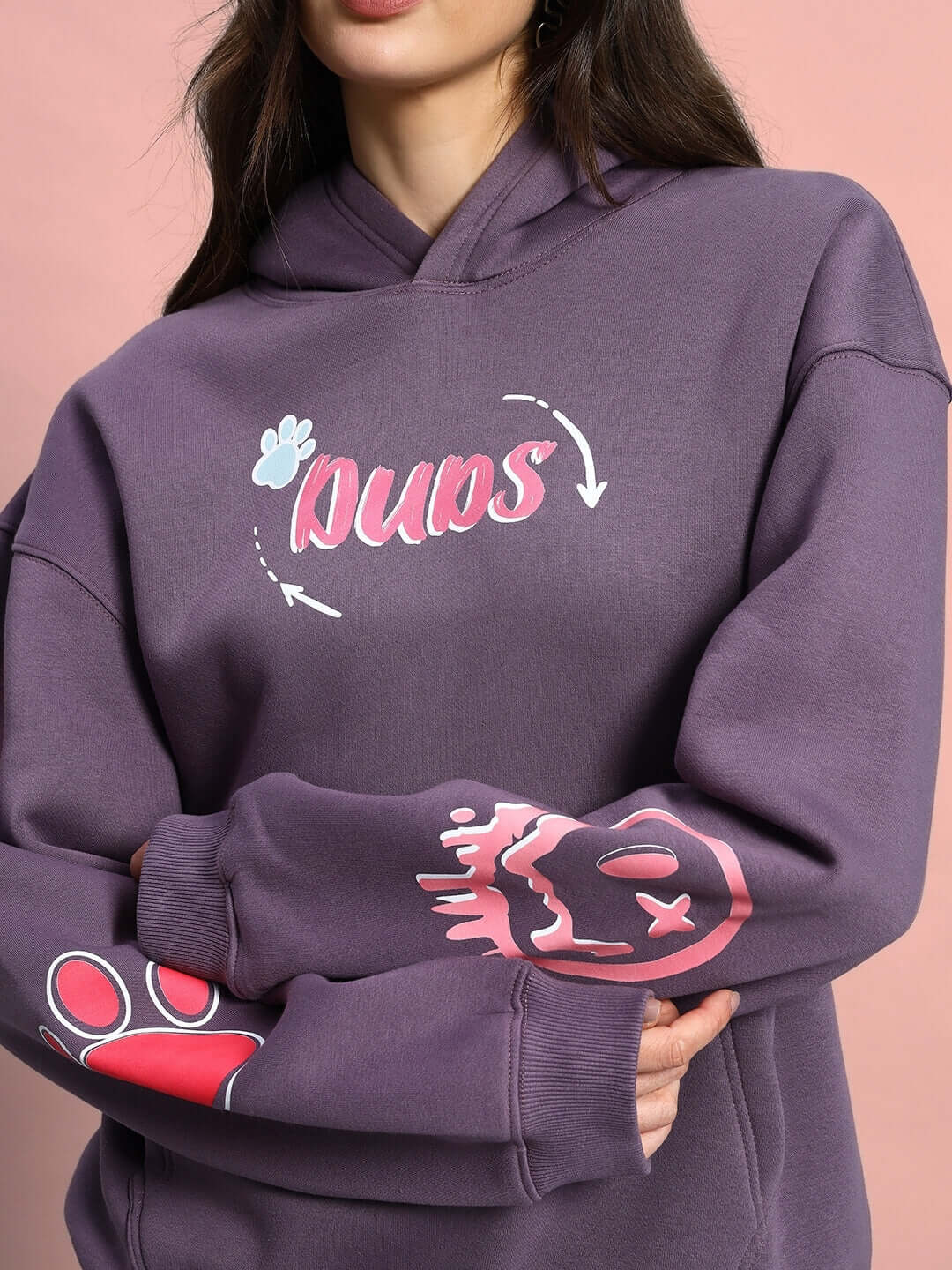 Fashion model wearing Women Casper Oversized Fleece Hoodie Violet with graphic design, showing vibrant streetwear style.