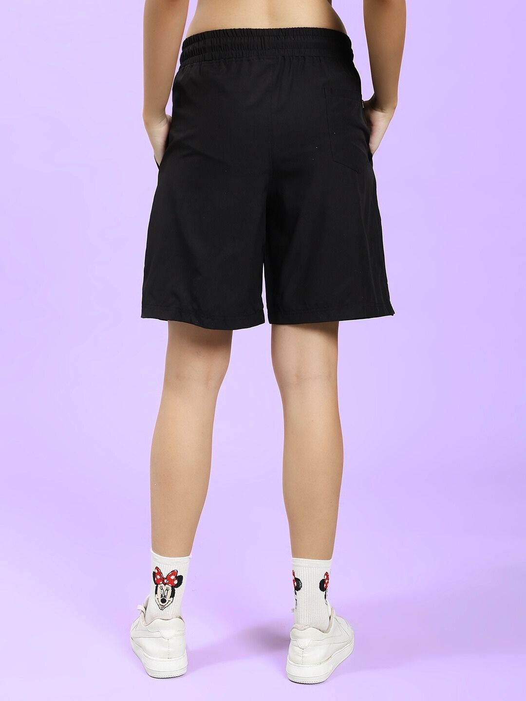 Back view of WOMEN CHAMPION ZONE FRONT PLATED SHORTS BLACK, showcasing modern style and athletic fit.