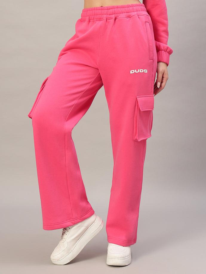 WOMEN CHARM FLEECE COLORBLOCK CARGO PANT PINK displayed on model, showcasing vibrant pink color and cargo pockets for stylish comfort.