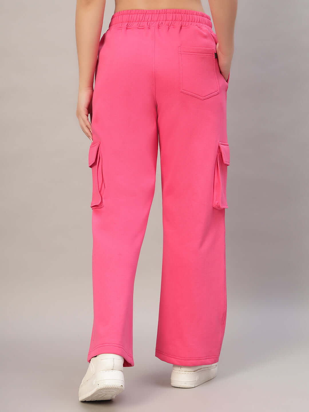Back view of WOMEN CHARM FLEECE COLORBLOCK CARGO PANT PINK showcasing pockets and colorblock design.