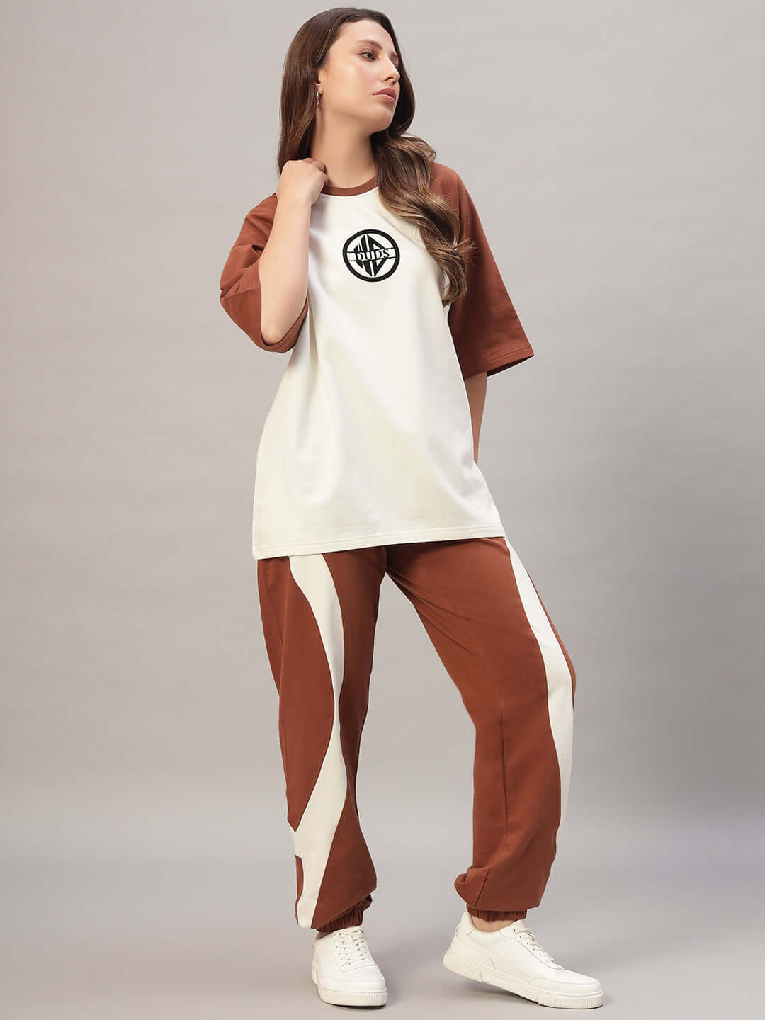 Model wearing Women's Cocoa Co-Ord Set in off white and brown, made of premium cotton French Terry Lycra, showcasing stylish casual wear.