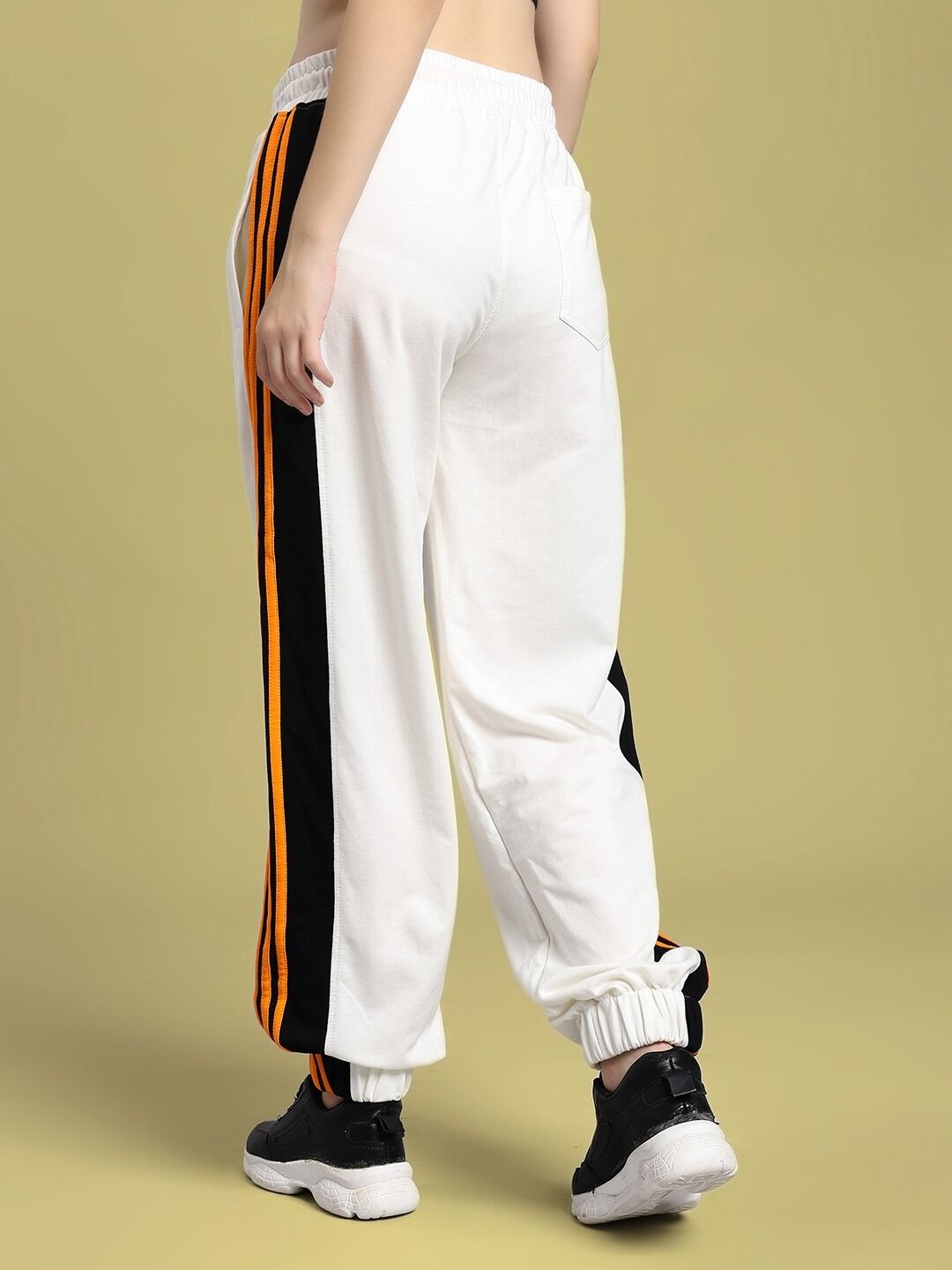 Back view of WOMEN'S COMFORT FLEX STRIPE JOGGER OFF-WHITE highlighting the soft stretchy fabric and vertical stripes.