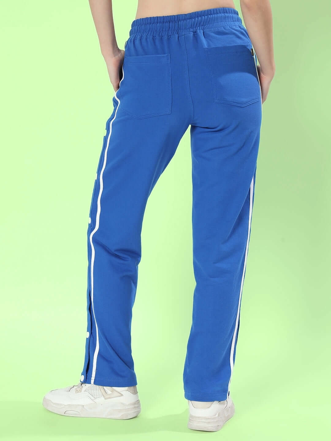 Back view of Women's Blue Contrast Panel Joggers with white stripes, showcasing sporty, relaxed fit.