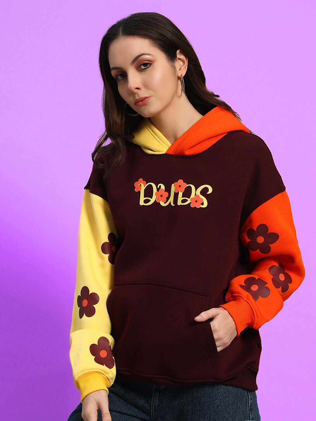 Women's Cosmos Oversized Fleece Hoodie in multi-color with floral patterns and bold design on a vibrant background.