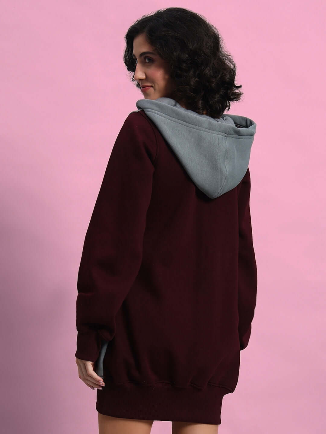 Back view of WOMEN CRISS CROSS FLEECE HOODIE WINE GREY on model, showcasing the two-tone design and cozy fit.
